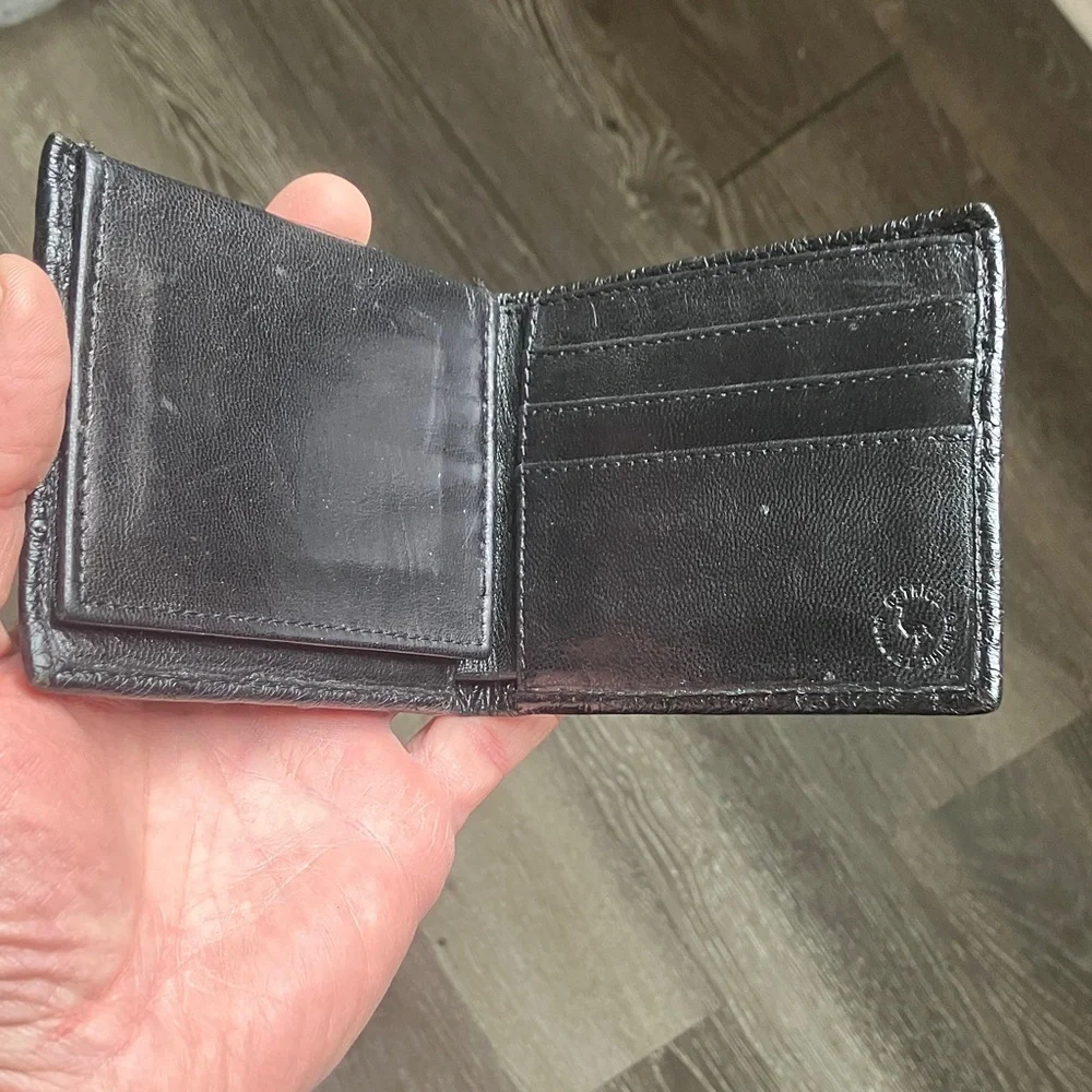 black bifold wallet made from genuine ostrich leather.